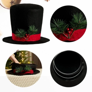 Detail of a black felt Christmas top hat tree topper with red ribbon and pine needles