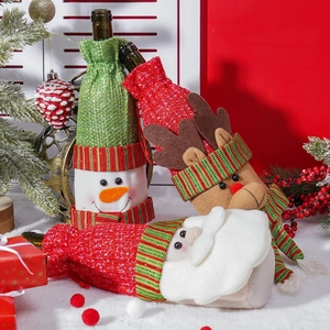 Three Christmas wine bottle covers featuring Santa, Reindeer and Snowman designs