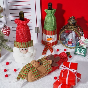 Three Christmas wine bottle covers featuring Santa, Snowman and Reindeer knitted designs