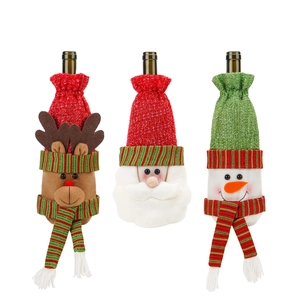 Three-piece Christmas wine bottle covers featuring reindeer, Santa, and snowman designs
