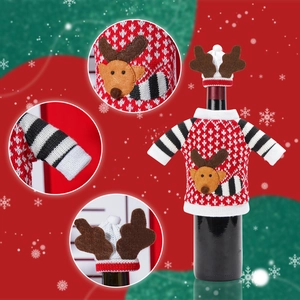 Knitted Christmas reindeer wine bottle cover with mini antler hat and sweater
