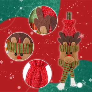 Detail view of knitted reindeer wine bottle cover with cozy scarf and drawstring closure