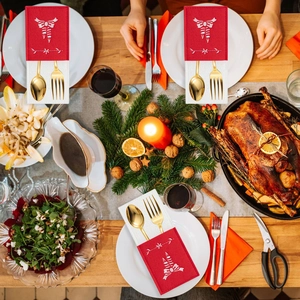 Festive Christmas felt cutlery holder set on a warm holiday dining table with turkey