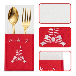Detailed embroidery of candle and floral patterns on red felt Christmas cutlery bag