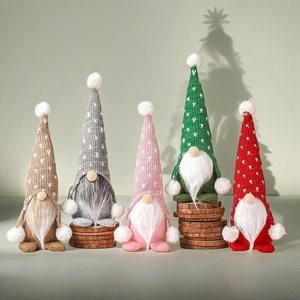 Set of five handmade Christmas gnomes with knitted heart hats and plush beards