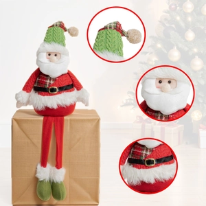 Detail of Santa plush toy with green knit hat and long red legs sitting on a box