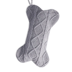Grey knit bone-shaped Christmas stocking for pets with decorative cable patterns