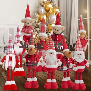 Group of Christmas plush toys featuring Santa and reindeer on festive background