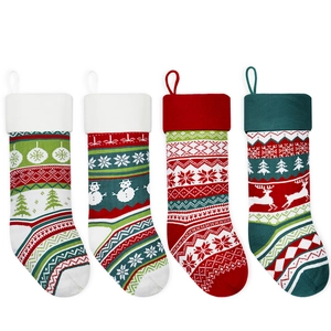 Set of four knitted Christmas stockings with festive reindeer and snowflake patterns