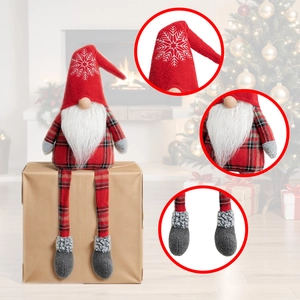 Christmas plush gnome with snowflake red hat and long legs in a festive home setting