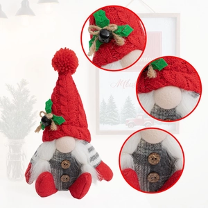 Detail of Christmas gnome with red knit hat, wooden buttons and small bell ornament