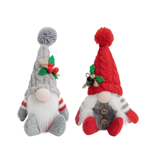 Pair of festive knitted Christmas gnomes with grey and red hats for holiday home decor