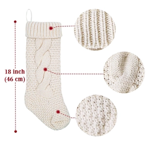 Detail showing 18 inch white cable knit Christmas stocking with thick texture and loop