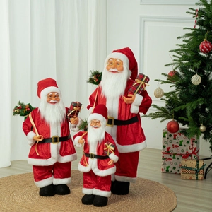 Three Santa Claus figurines in different sizes with red velvet suits and gift bags