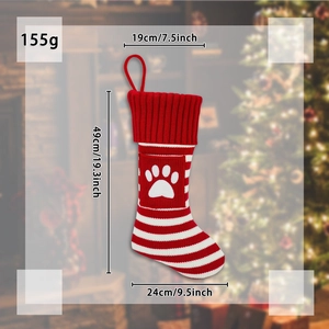 Christmas pet-themed knitted stocking with red-white stripes and white paw print pattern