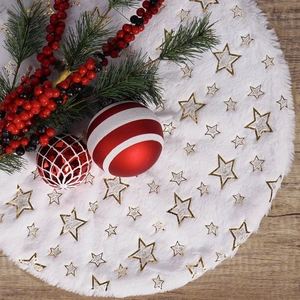 White faux fur Christmas tree skirt with gold sequin stars on dark wood floor