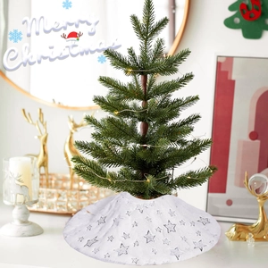 White plush Christmas tree skirt with silver stars and LED lights for holiday decoration