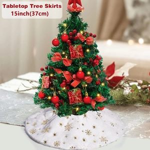 Close-up of 15 inch white plush tabletop tree skirt with gold sequin snowflake patterns