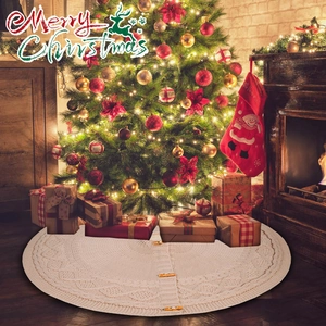 Detail of cream knitted Christmas tree skirt featuring rustic wooden toggle buttons