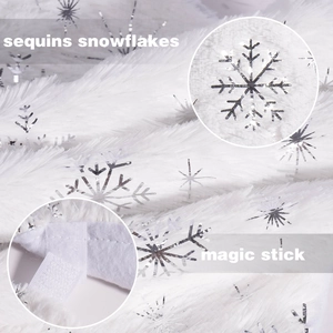 Close-up of white faux fur Christmas tree skirt with silver sequins and magic stick closure