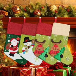 Set of 4 Christmas stockings with Santa, snowman and reindeer designs for fireplace decor