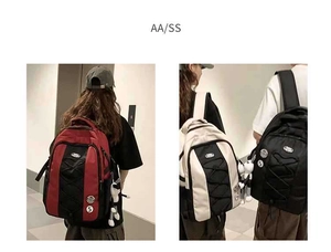Vue détaillée de grands sacs à dos en nylon en diverses couleurs au design spacieux