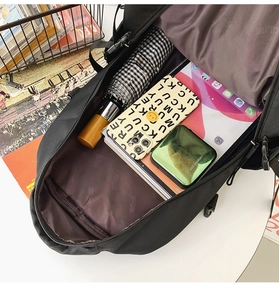 Vue intérieure du grand sac à dos en nylon montrant le rangement tablette et parapluie