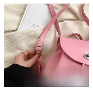Detail of adjustable pink PU leather backpack strap with durable silver metal buckle