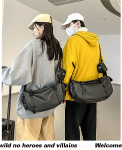 Close-up of black matte messenger bag featuring a detachable small pouch and techwear style