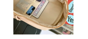 Detail view of large capacity backpack interior showing multi-functional organizer pockets