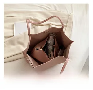 Top view of pink tote bag showing spacious interior with storage pouch and scarf