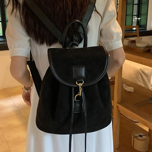 Elegant black frosted suede backpack for women with gold hook closure and drawstring details