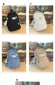 Four colors of large capacity nylon backpacks with cute duck pendant and zip pockets