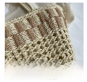 Macro shot of checkered straw tote bag showing intricate mesh weaving and cloth lining