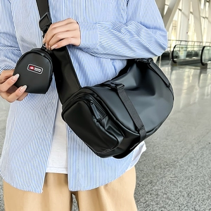 Large black crossbody travel bag with a matching round coin purse for sport and fashion