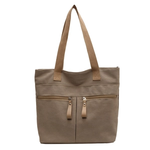 Large capacity khaki canvas tote bag with dual front zipper pockets and top handles