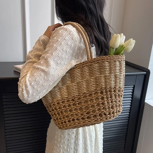Handwoven straw tote bag for women featuring hollow mesh texture and stylish double handles