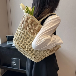 Handwoven straw tote bag with mesh design for summer beach and casual outings