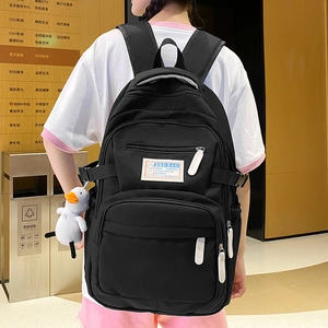 Large capacity black casual backpack with multiple zippers and a cute duckling pendant