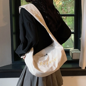 White Oxford hobo bag with yellow refeter embroidery and wide shoulder strap