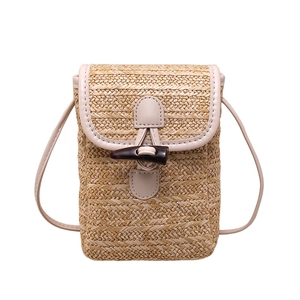 Straw mini crossbody phone bag with leather trim and horn buckle in minimalist style