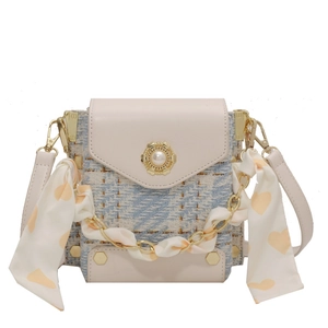 Pink quilted tweed crossbody bag with pearl floral lock and silk scarf chain strap