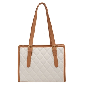 Classic quilted tote bag in cream faux leather with brown straps for stylish women commuting
