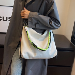 Large white nylon tote bag with neon green woven strap and sporty tactical design