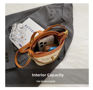 Interior view of the fashion bucket bag showing capacity for phone and wallet