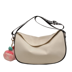Off-white crossbody saddle bag with black trim and adjustable lettered strap