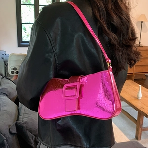 Pink faux crocodile leather underarm bag with metallic finish and buckle detail