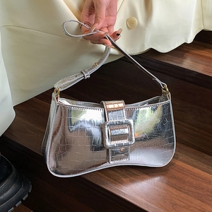 Metallic silver underarm bag with crocodile texture and large square buckle accent