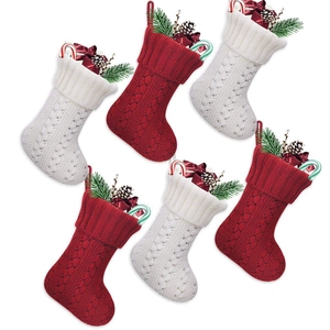 Set of 6 cable knit Christmas stockings in dark red and cream with pine cones and bows