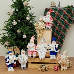 Standing Santa Claus figurines in colorful velvet and faux fur for festive indoor decor